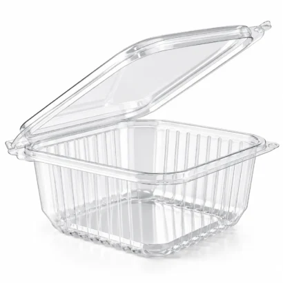 Transparent salad container with fixed lid on a dark surface